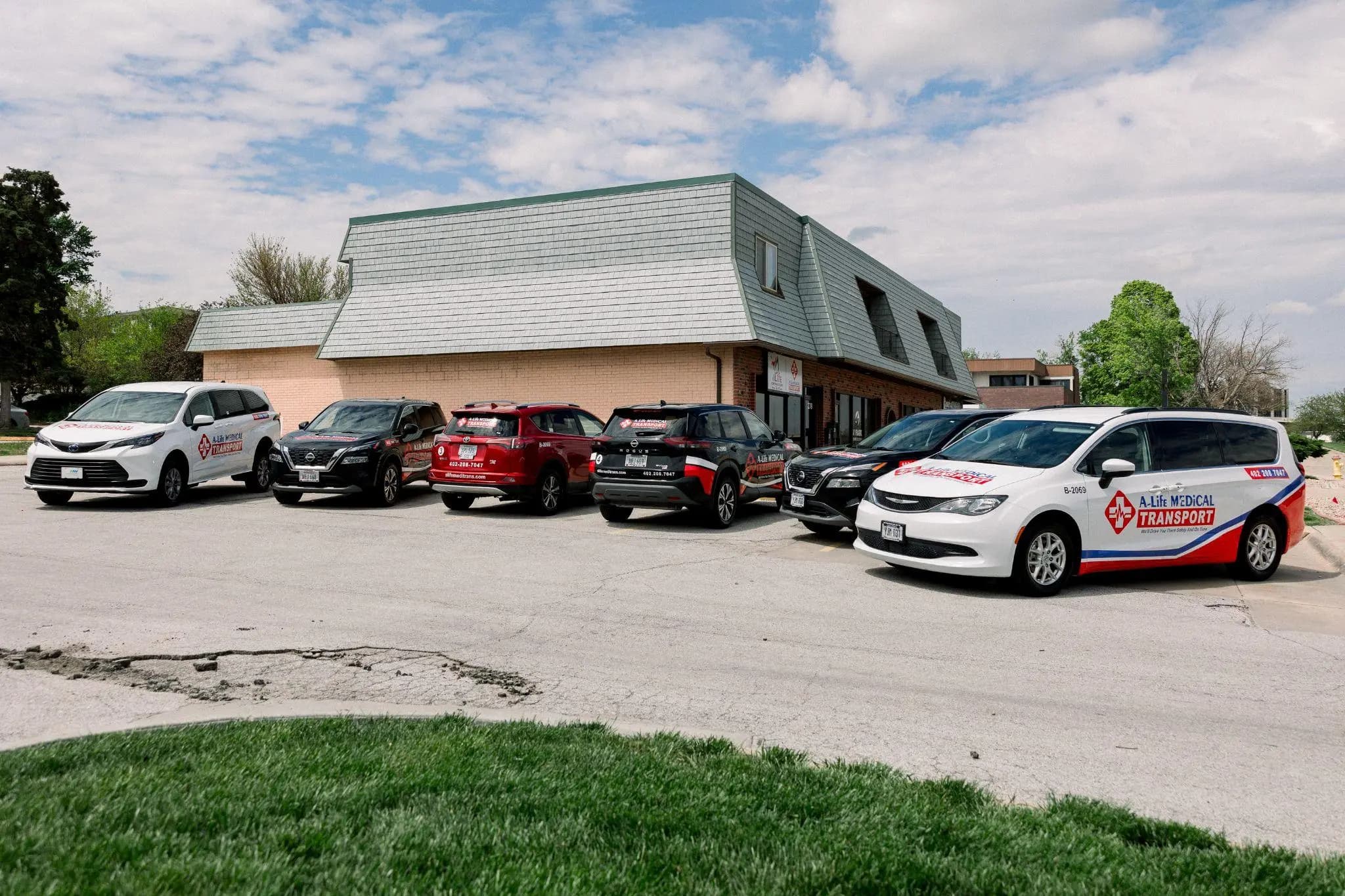 Some of the A-Life Medical Transport fleet parked at the Omaha office.