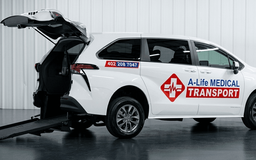 A-Life Medical Transport wheelchair-accessible Toyota Sienna with the rear ramp lowered.